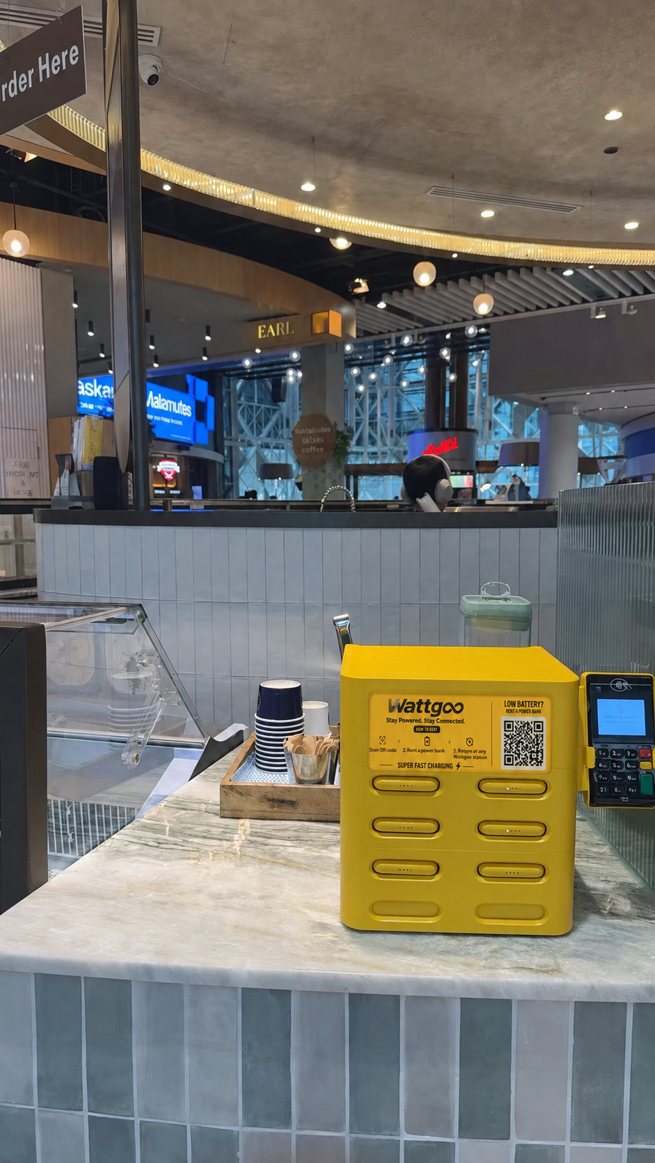 Wattgoo charging station on a café counter