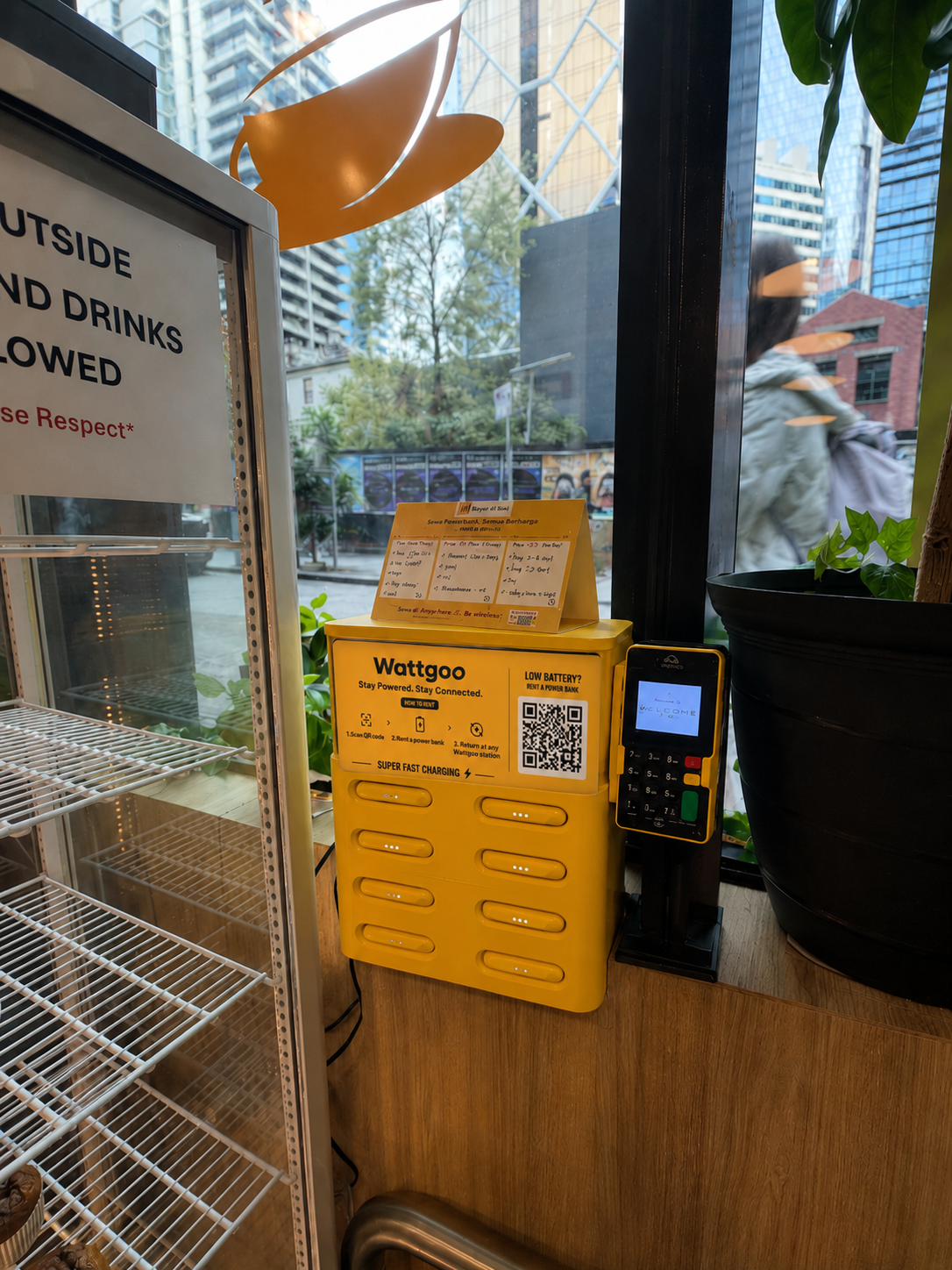 Wattgoo charging station beside a shop window